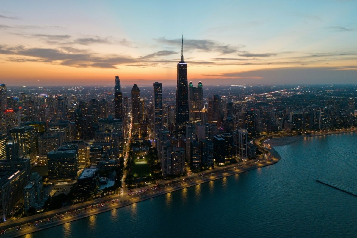 Chicago skyline beside Lake Michigan at dusk